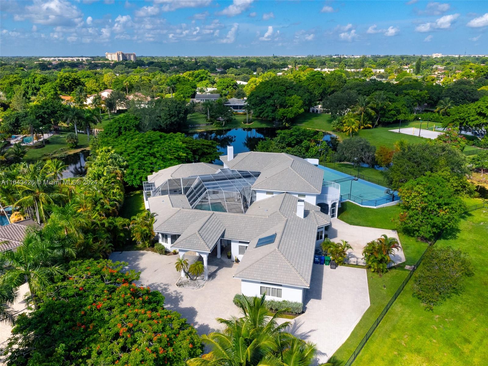 an aerial view of multiple house with outdoor space and street view