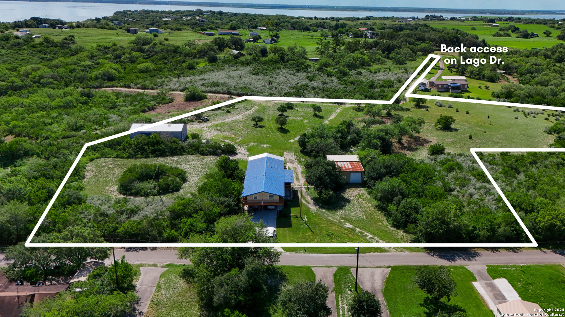 an aerial view of house with a swimming pool