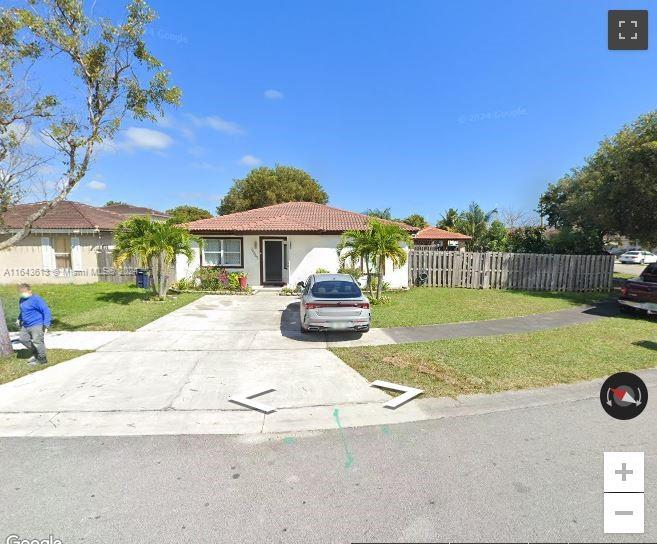 a front view of a house with yard