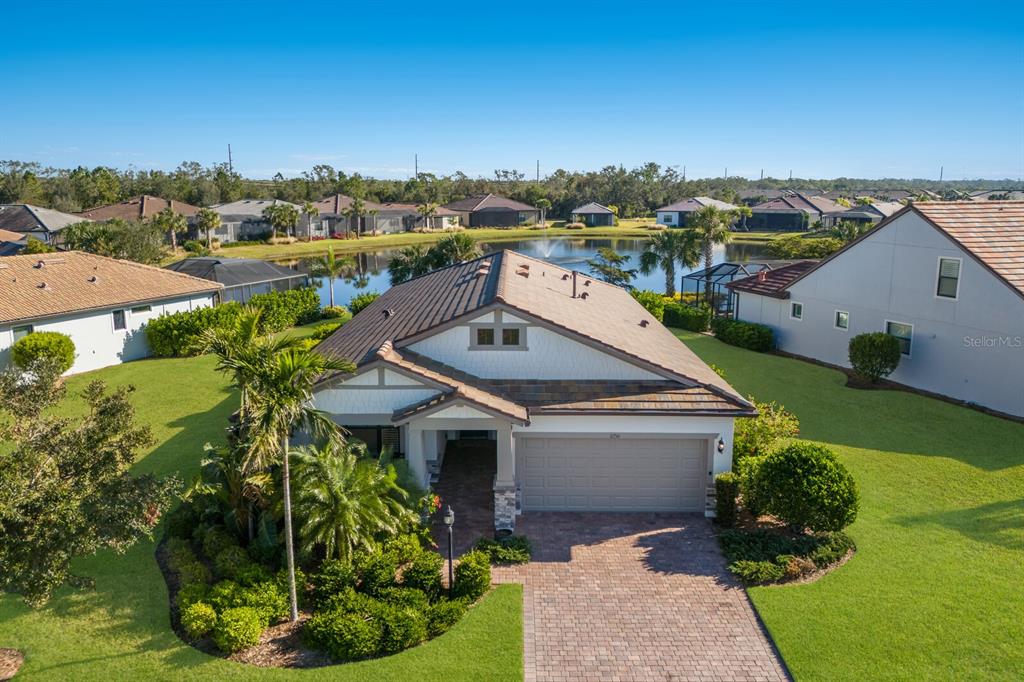 a aerial view of a house with a yard