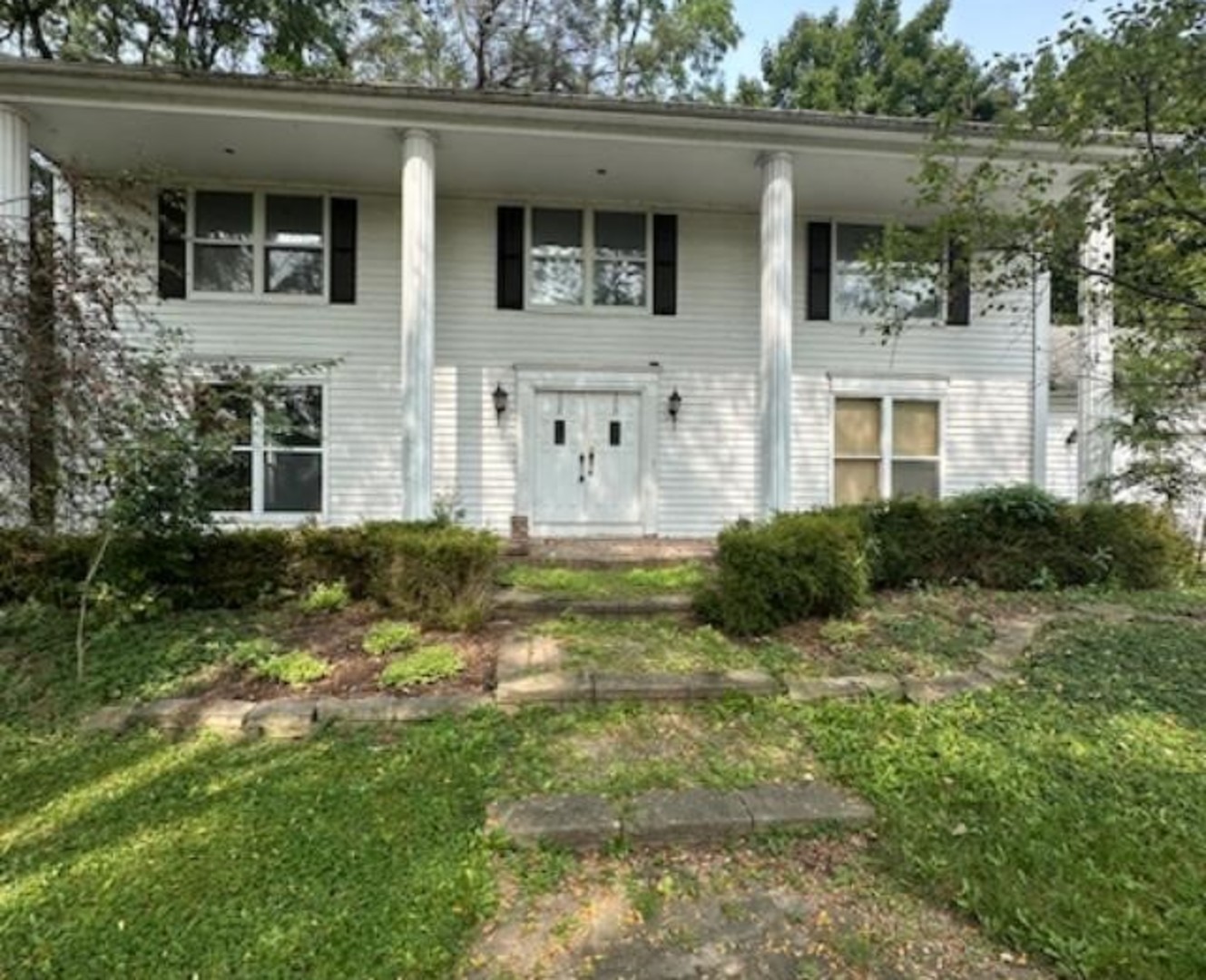 a view of house with yard