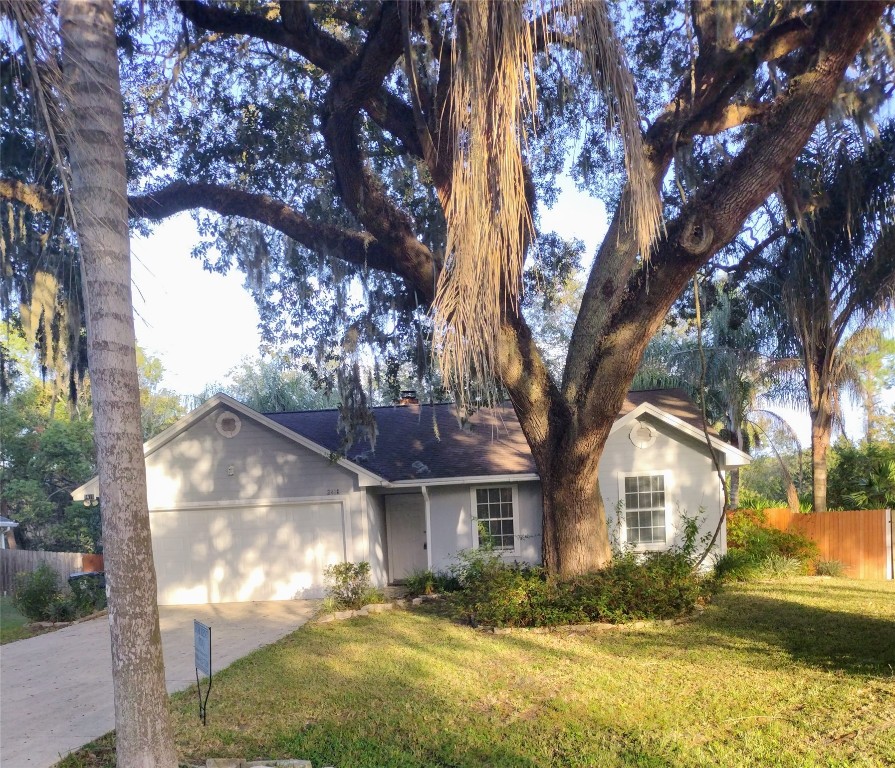 a view of house with yard