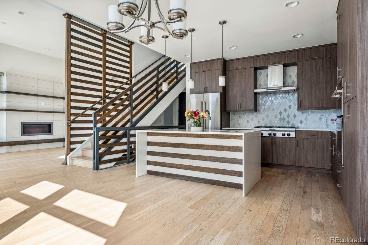 a kitchen view of counter top space and staircase