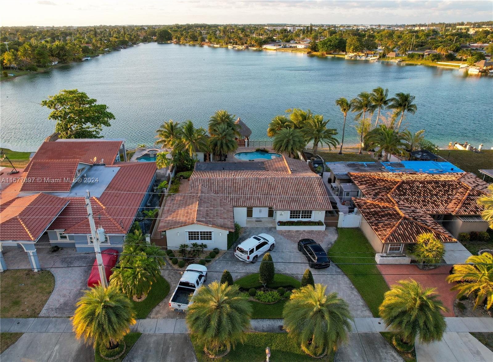 an aerial view of house with yard and lake view