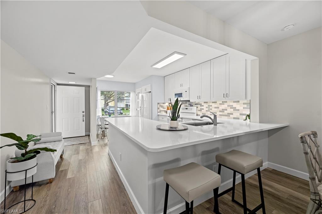 a kitchen with a table and chairs in it