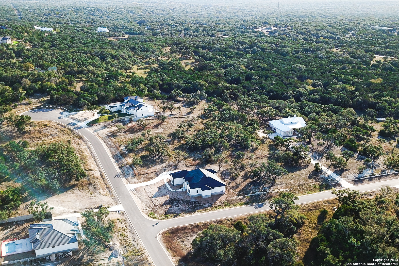 an aerial view of residential house with outdoor space