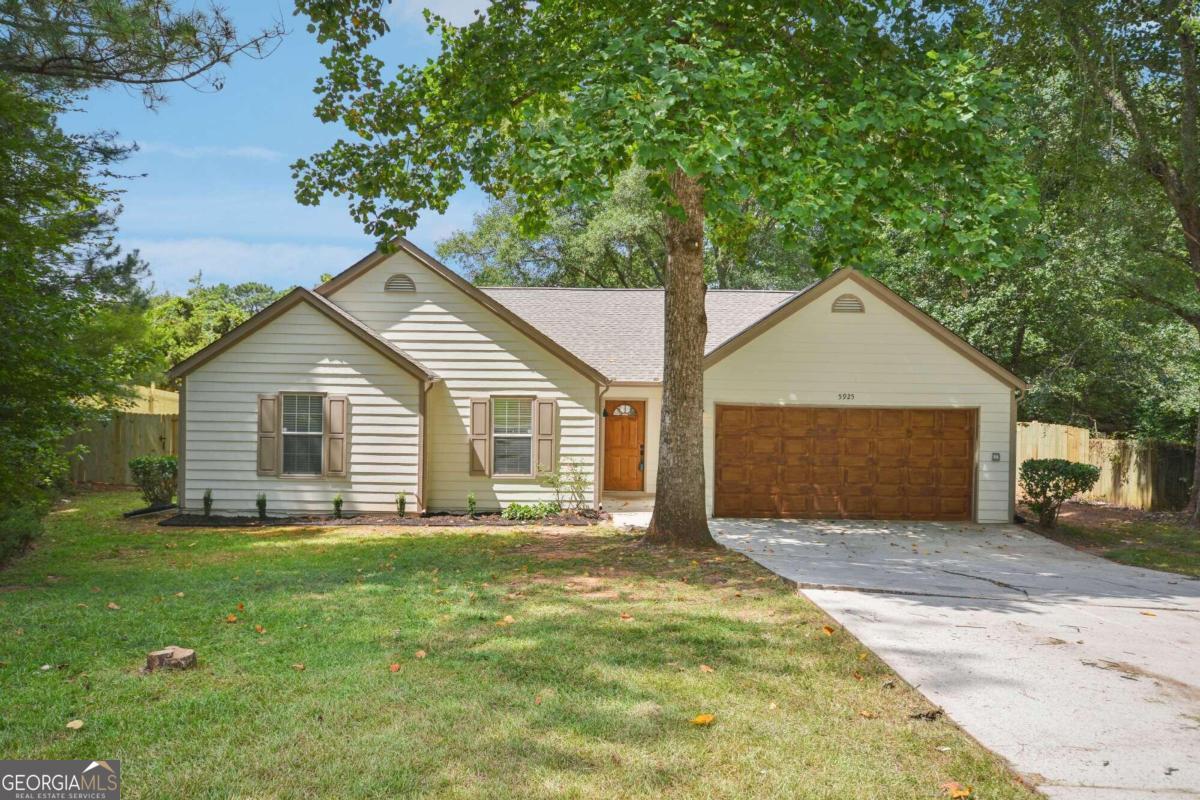 a house with trees in the background