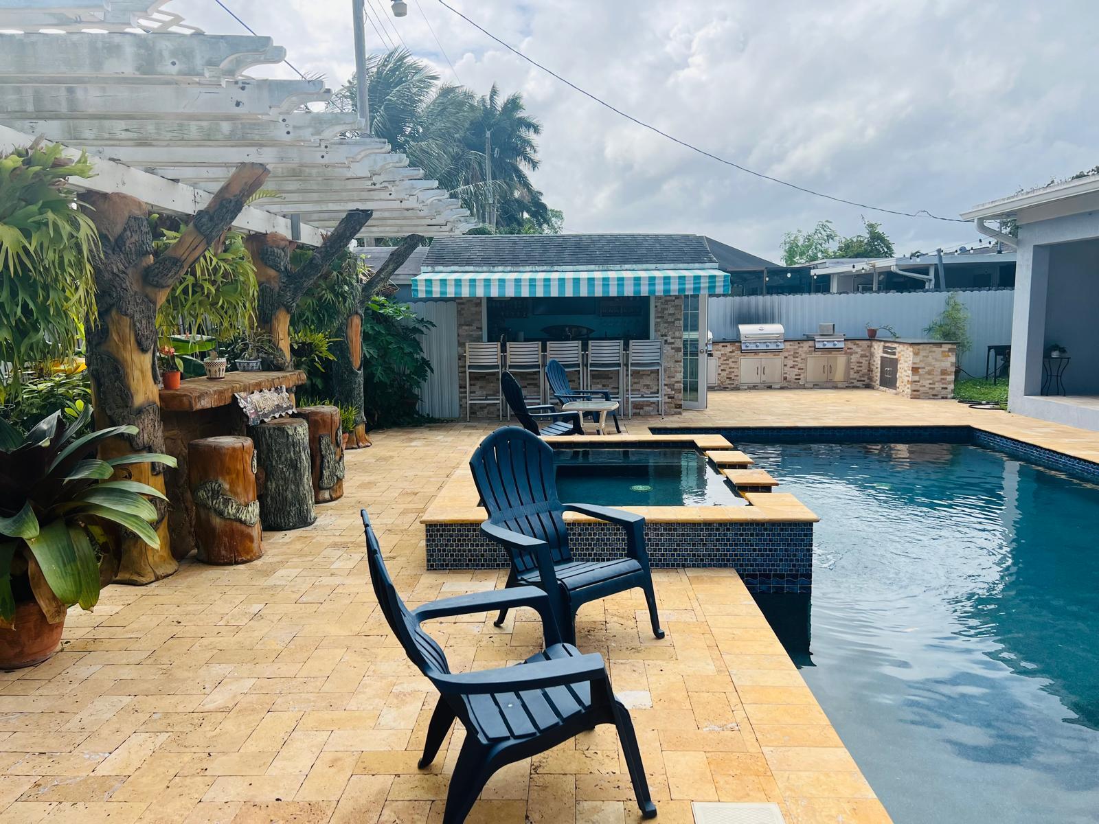 a view of a swimming pool with a patio and a outdoor space