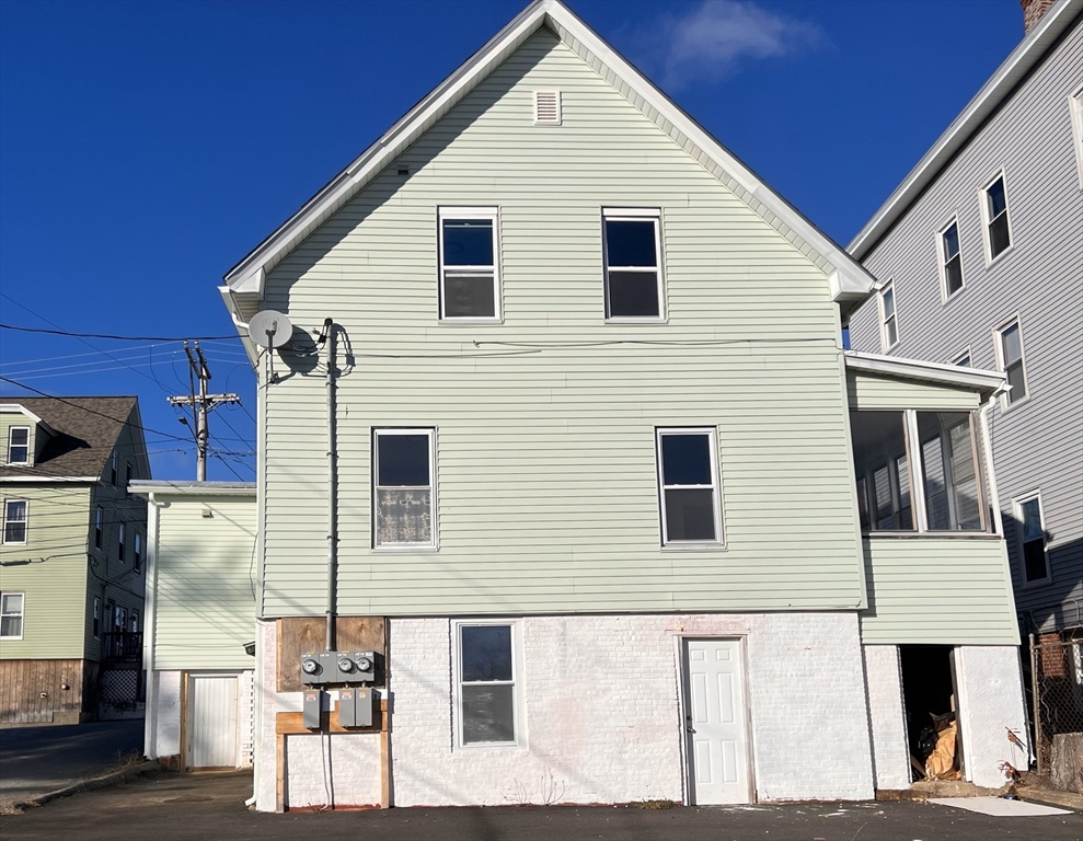 a front view of a house with many windows