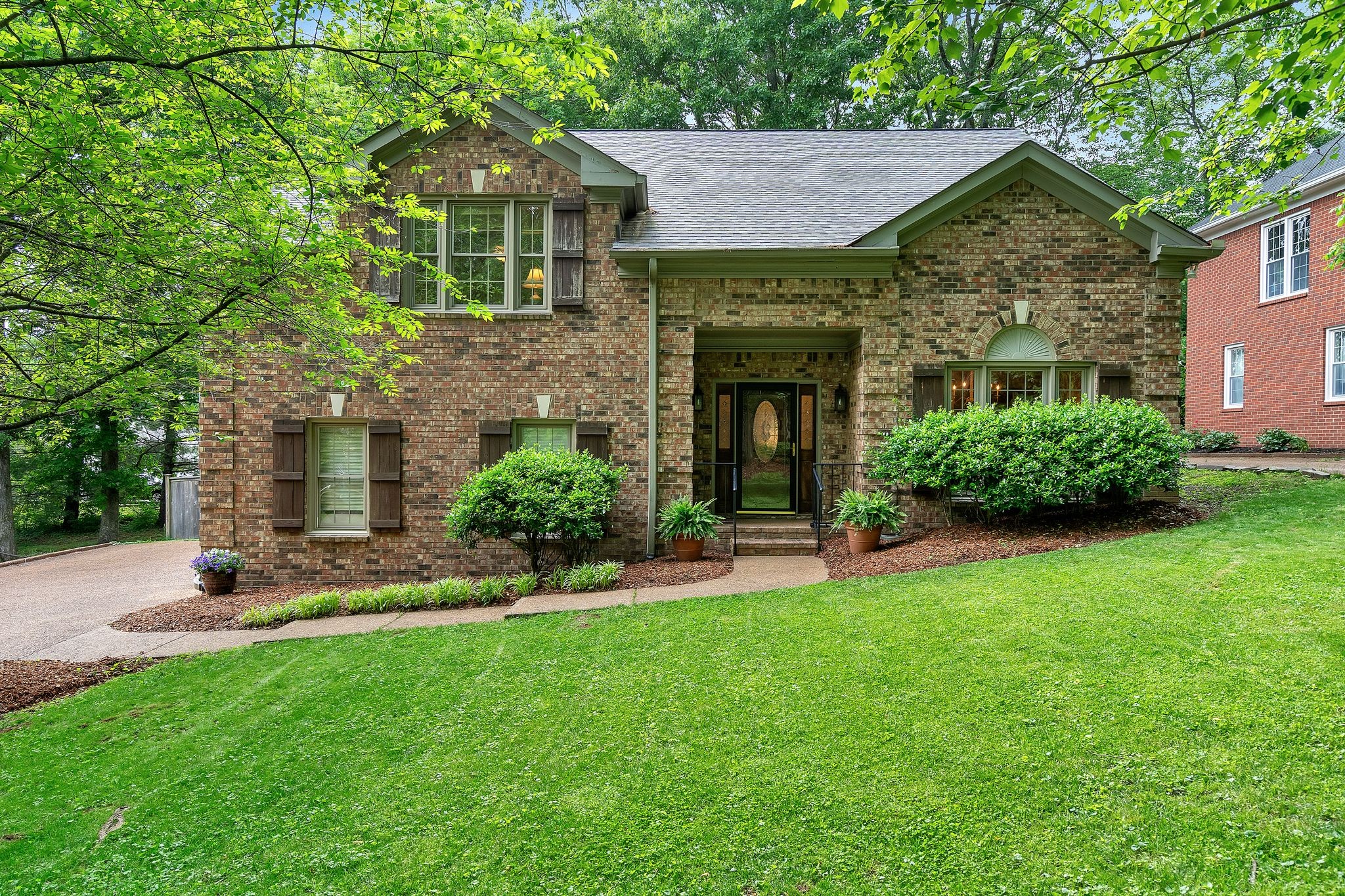 front view of a house with a yard