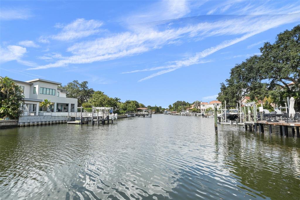 a view of residential house with outdoor space and lake view