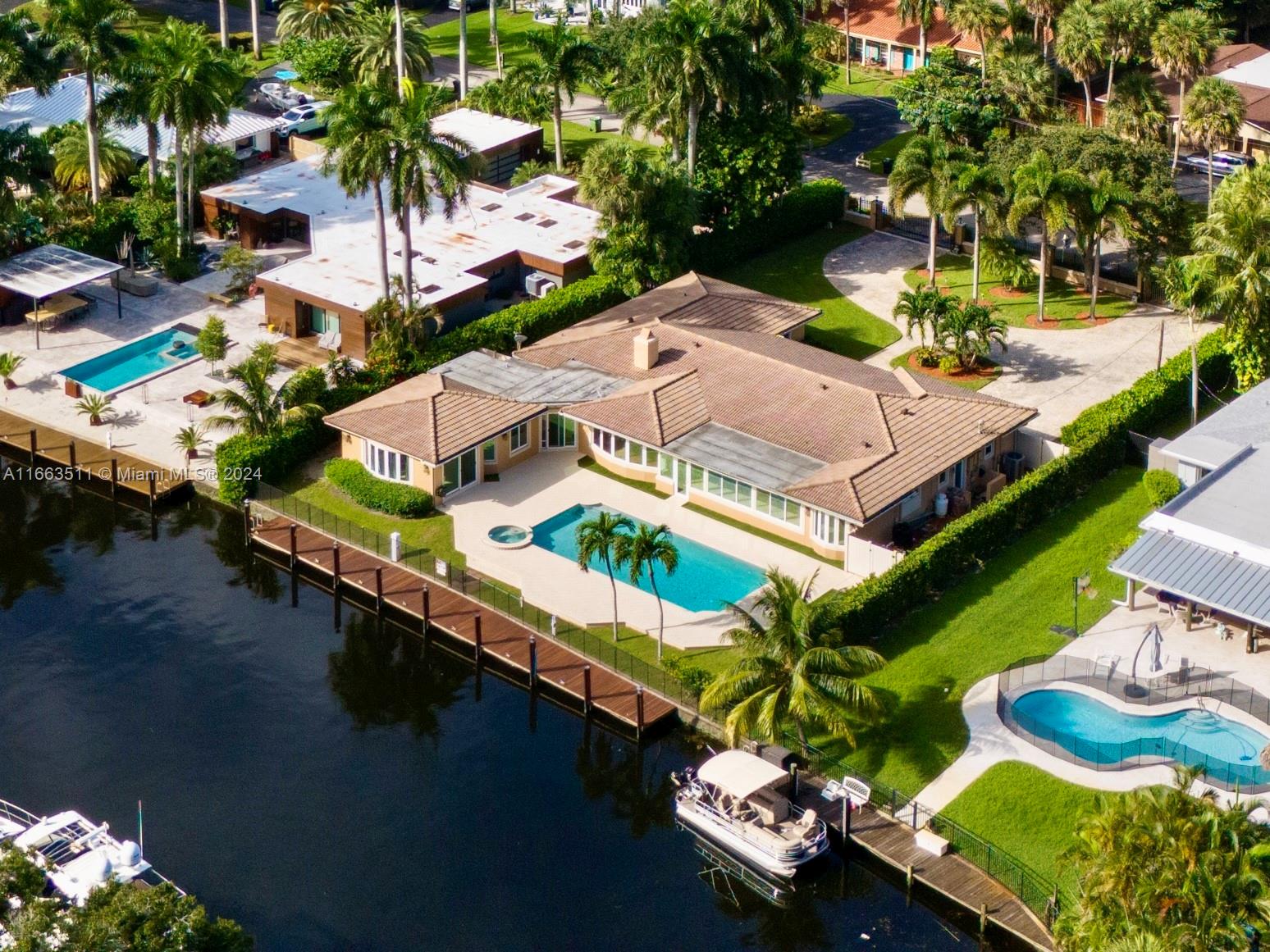 an aerial view of a house with a ocean view