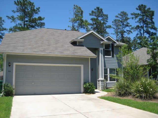 a front view of a house with yard