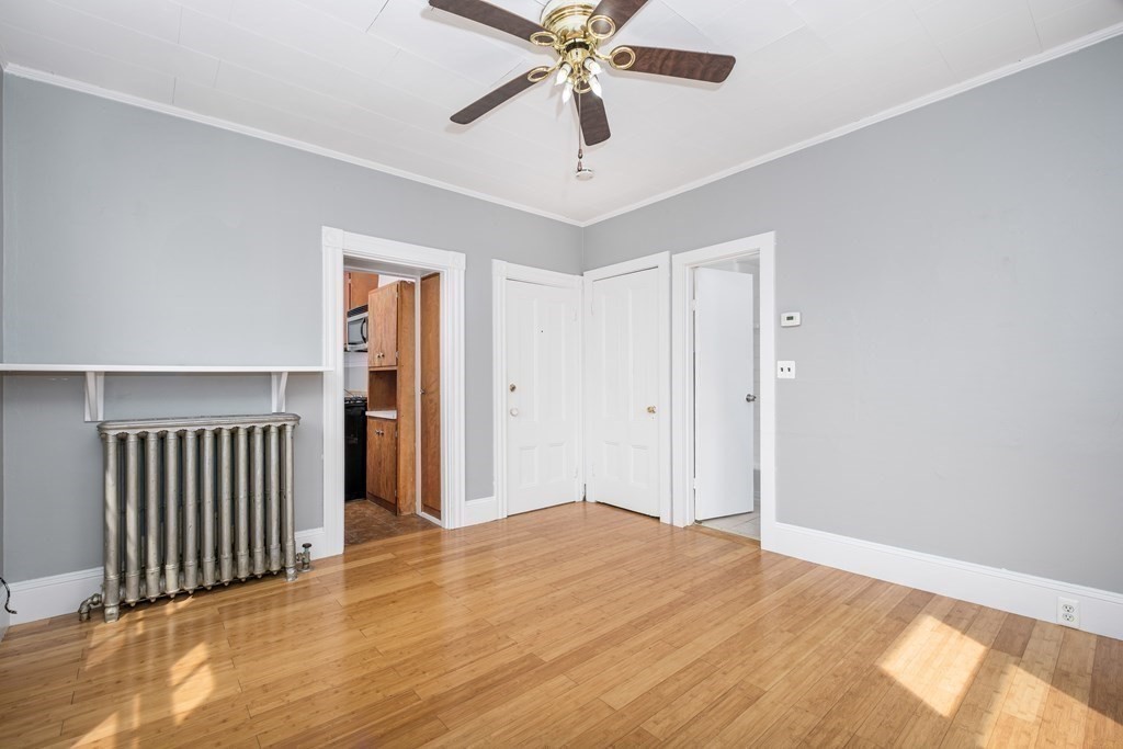 a view of a livingroom with a chandelier fan