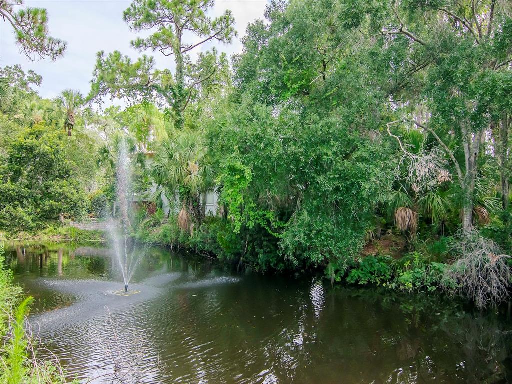 a view of lake with a yard