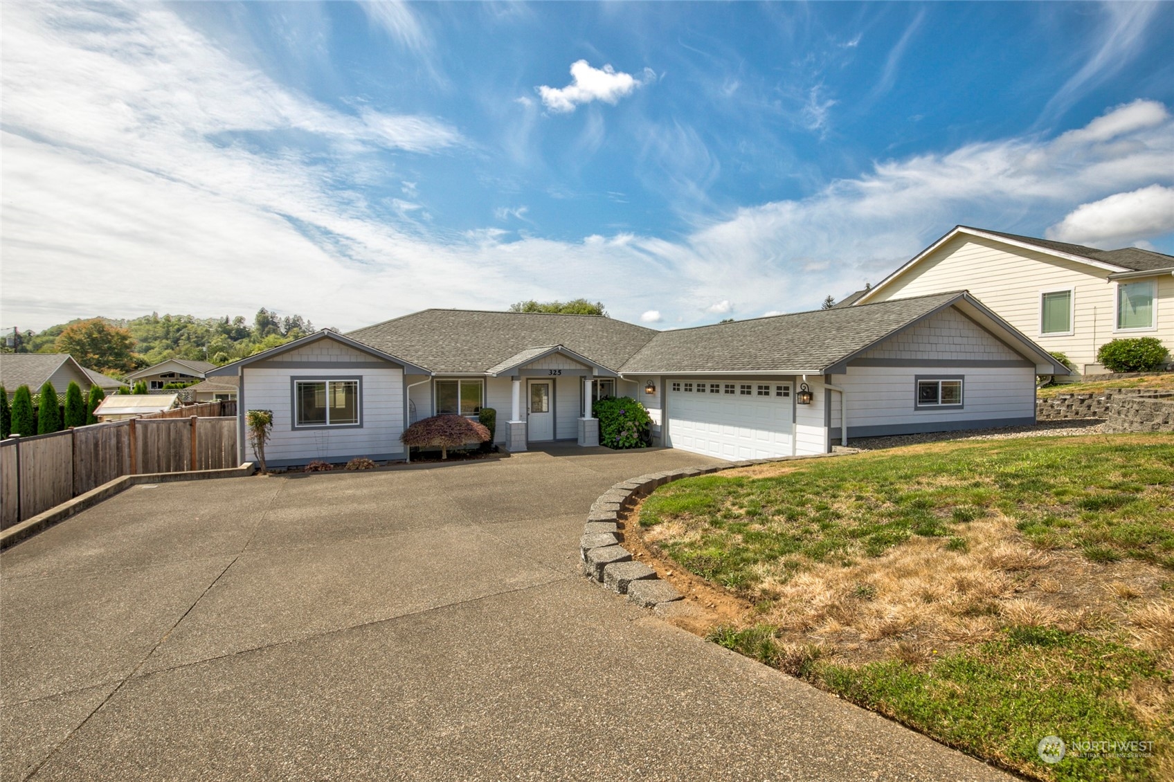 a front view of a house with yard