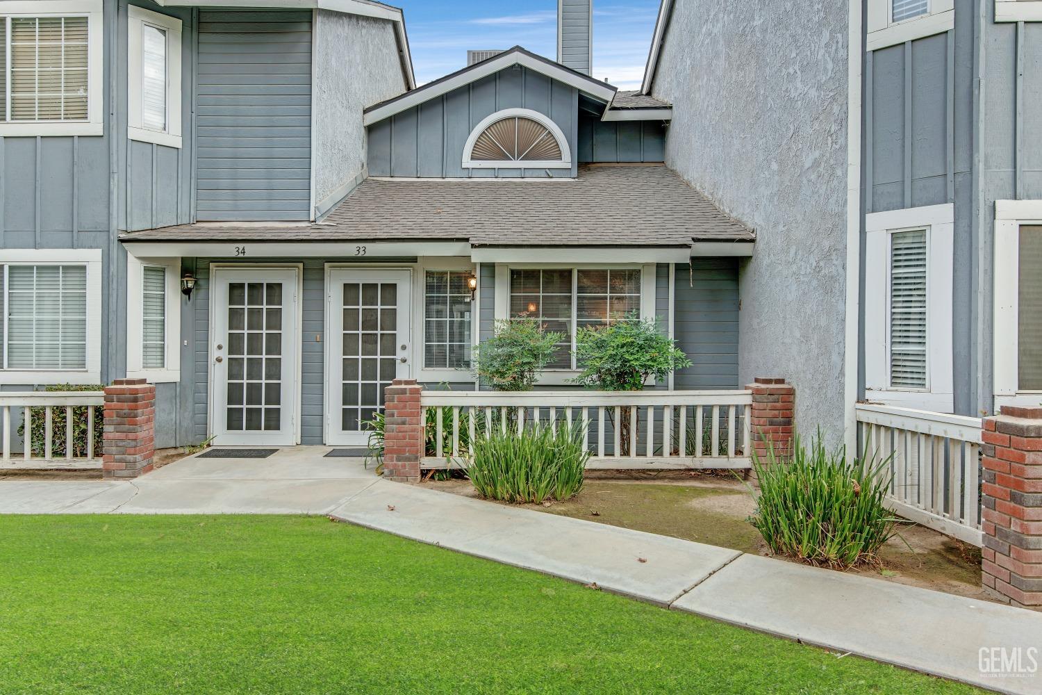 a front view of a house with garden