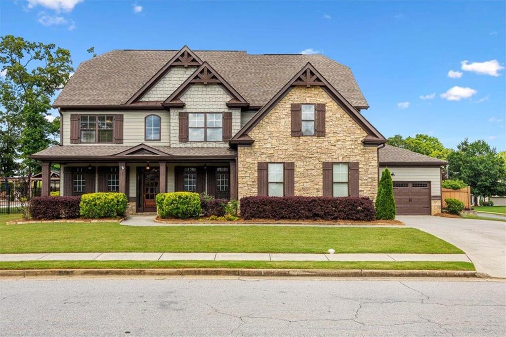 a front view of a house with a yard