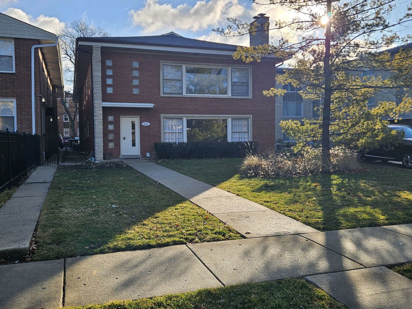 a view of house with yard