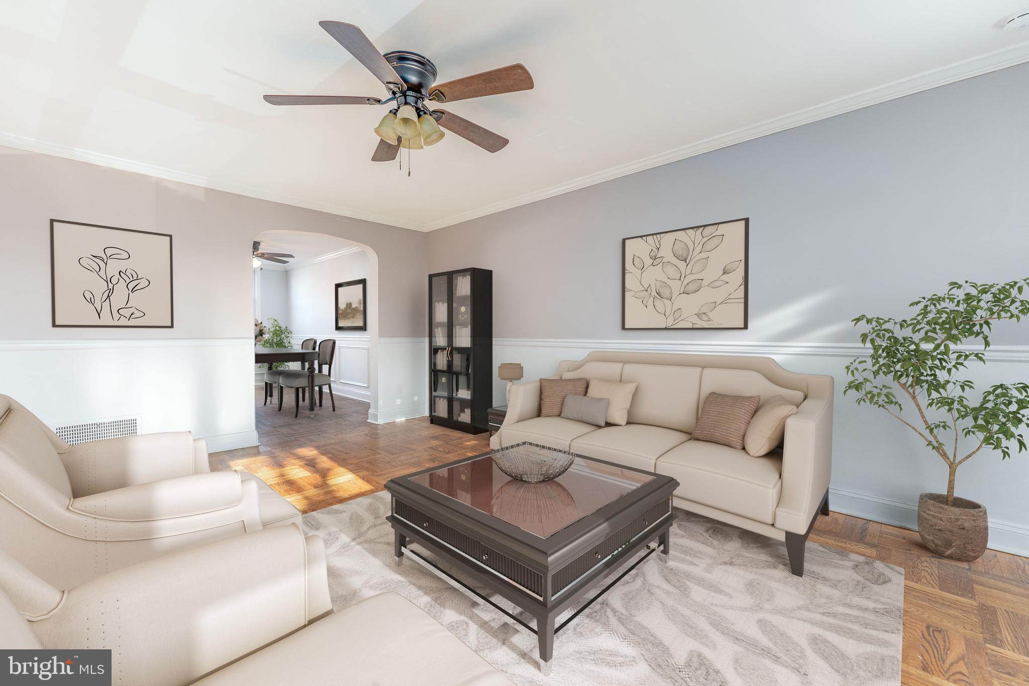 a living room with furniture and a chandelier