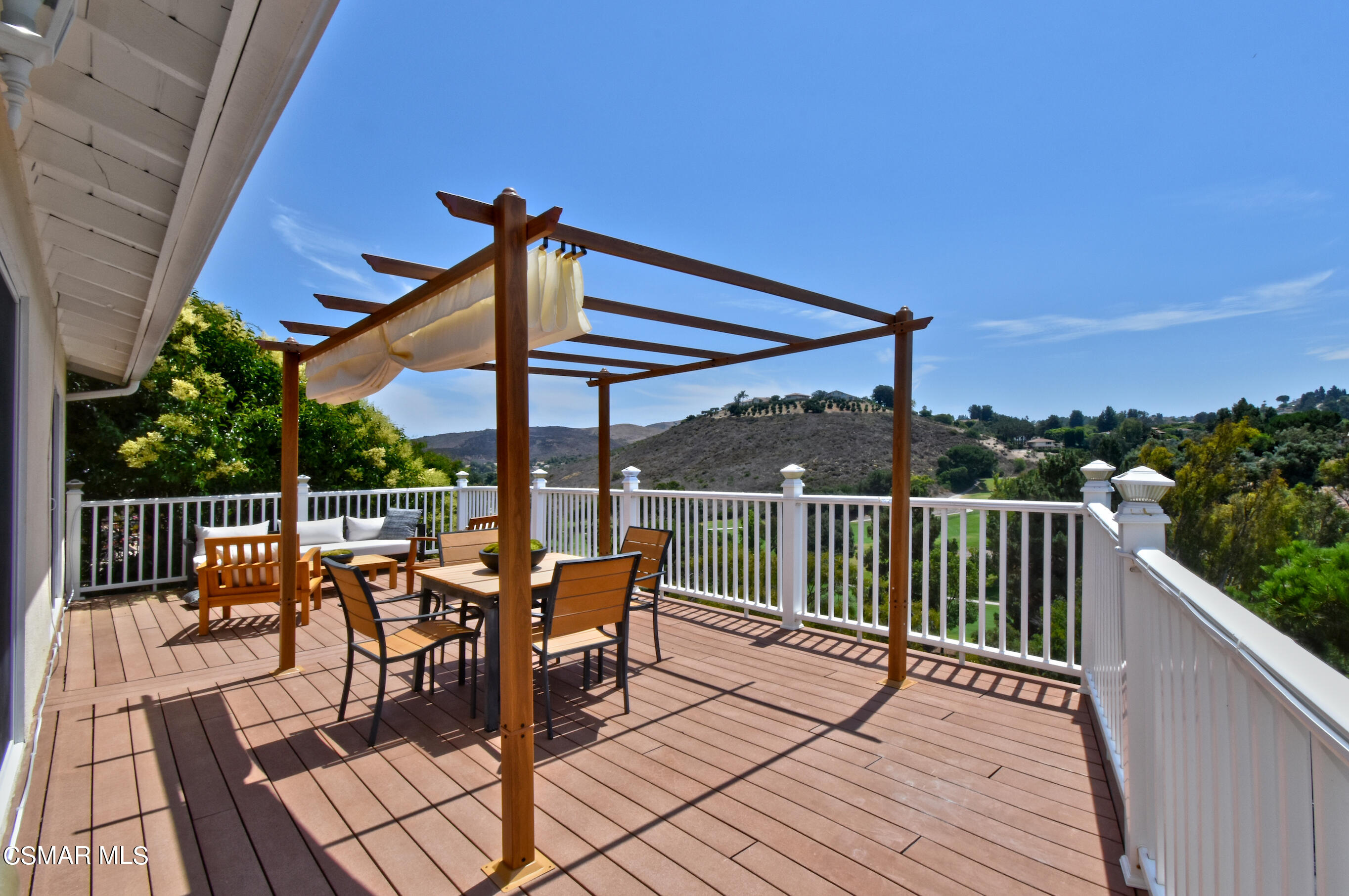 a view of a two chairs on the roof deck