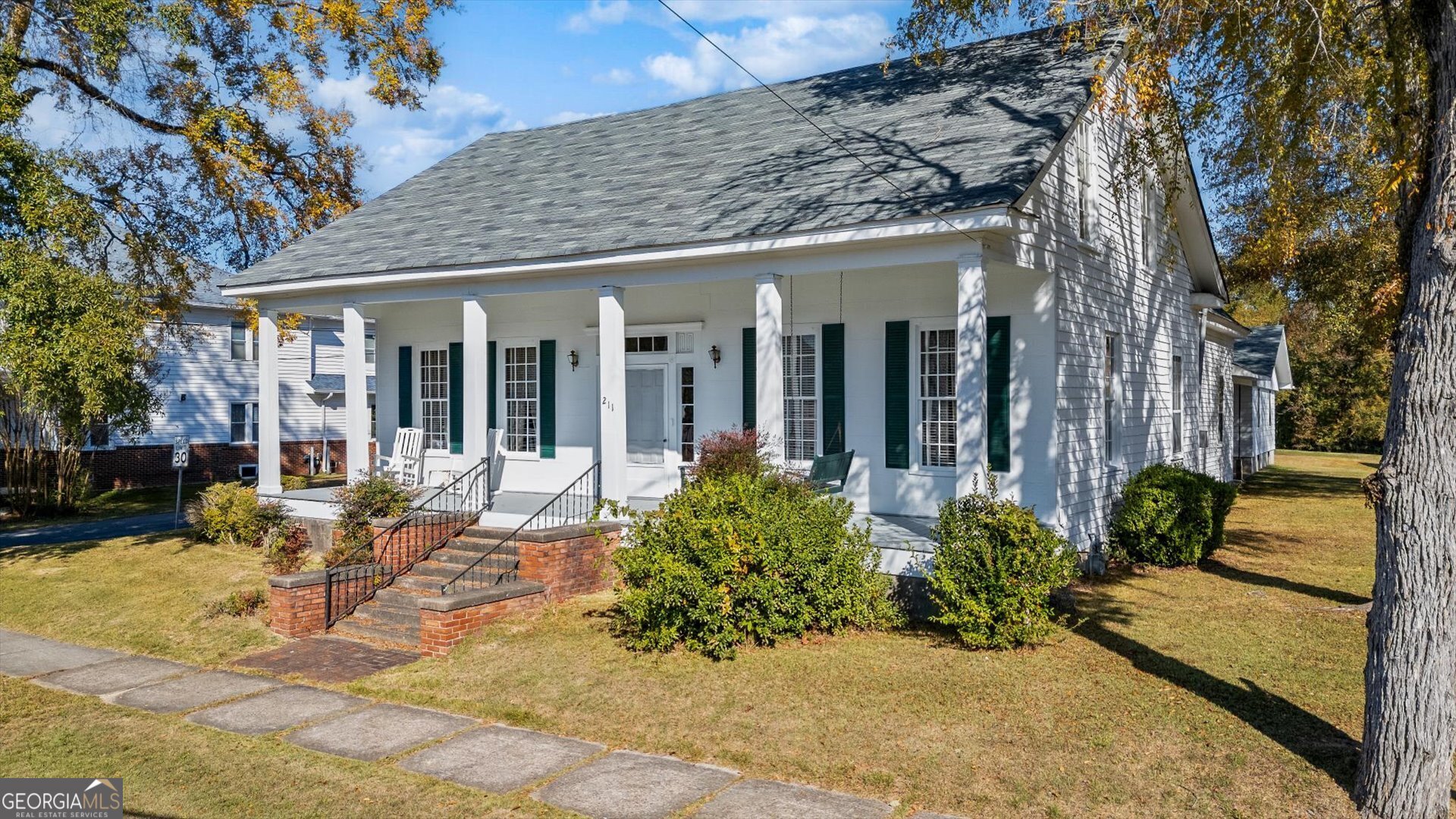 a view of a house with outdoor seating