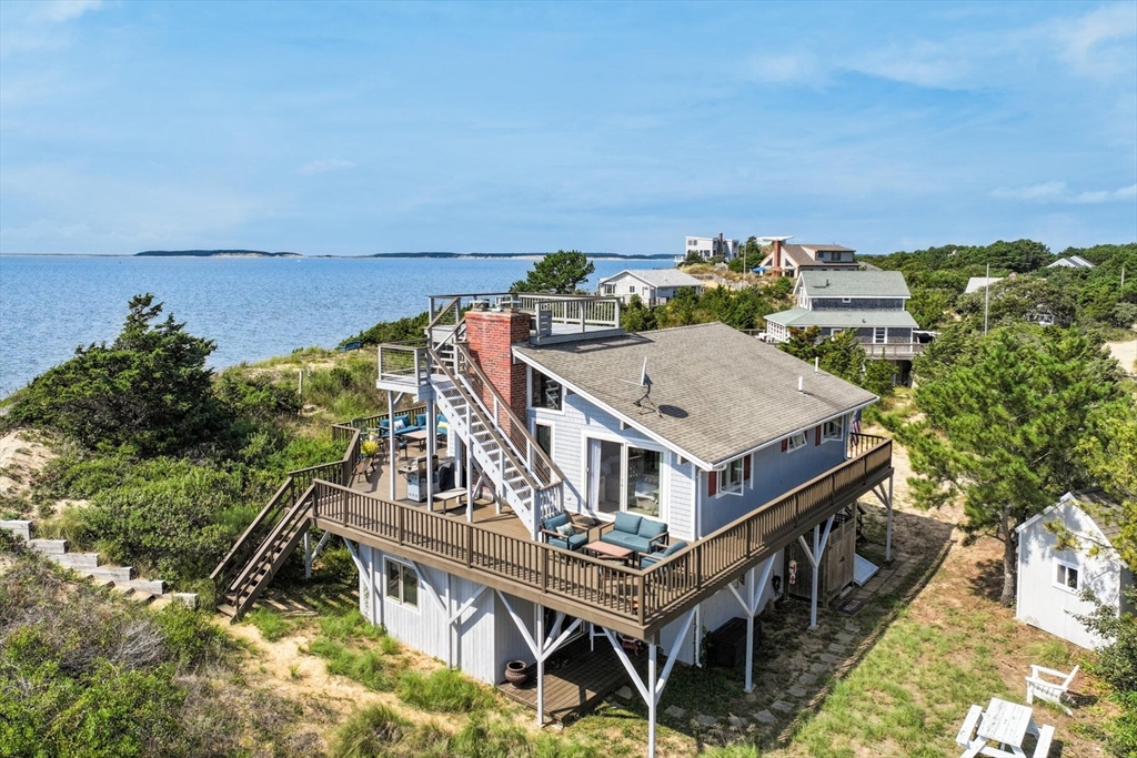 a view of a house with roof deck with outdoor space