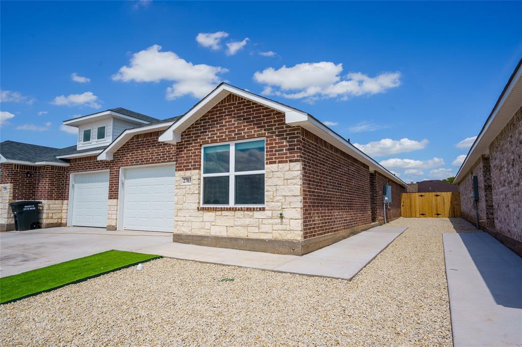 a view of house with yard