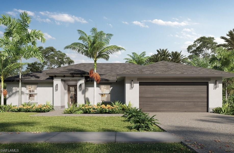 View of front of house with a garage and a front yard