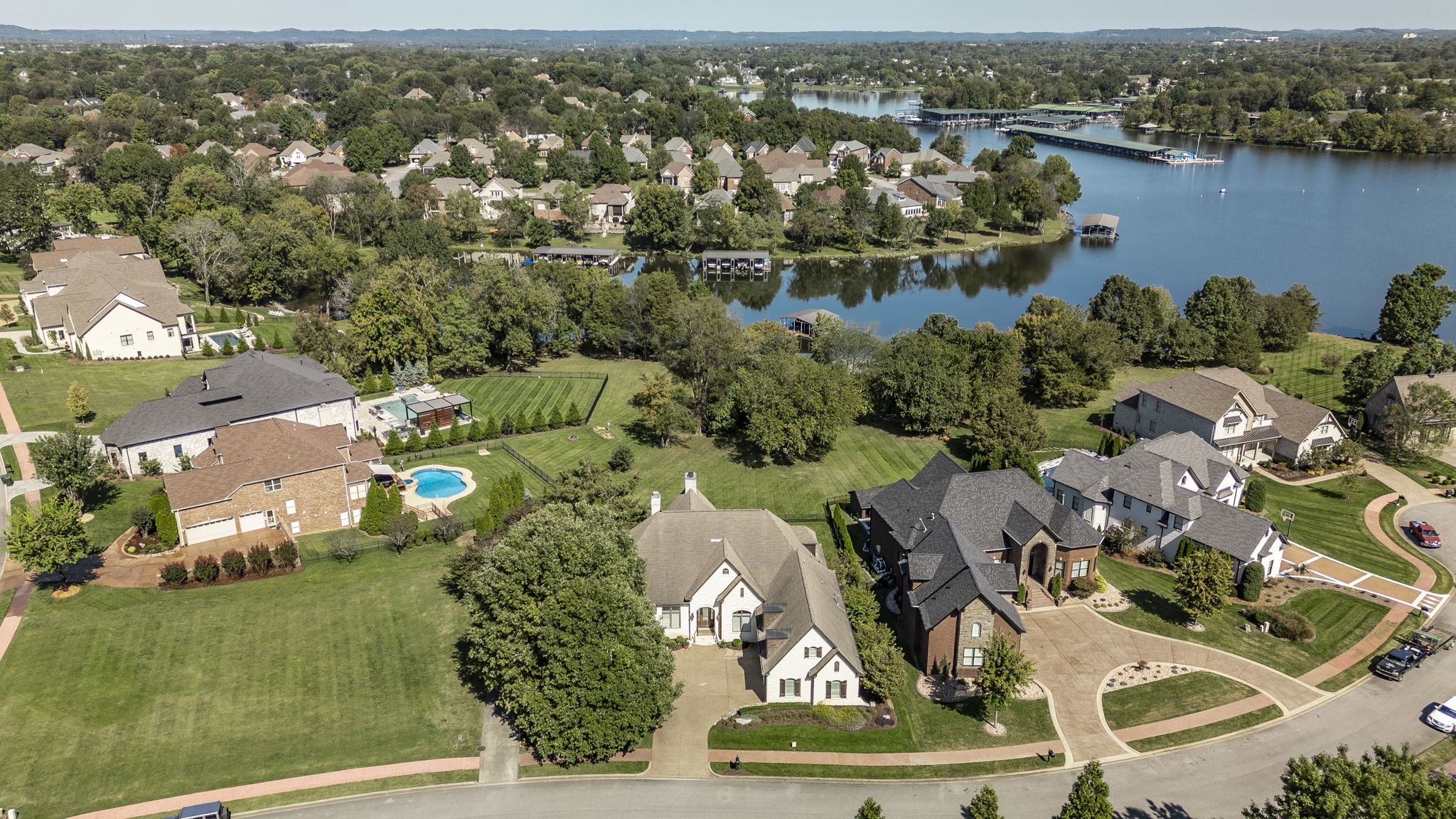 an aerial view of a house with a lake view