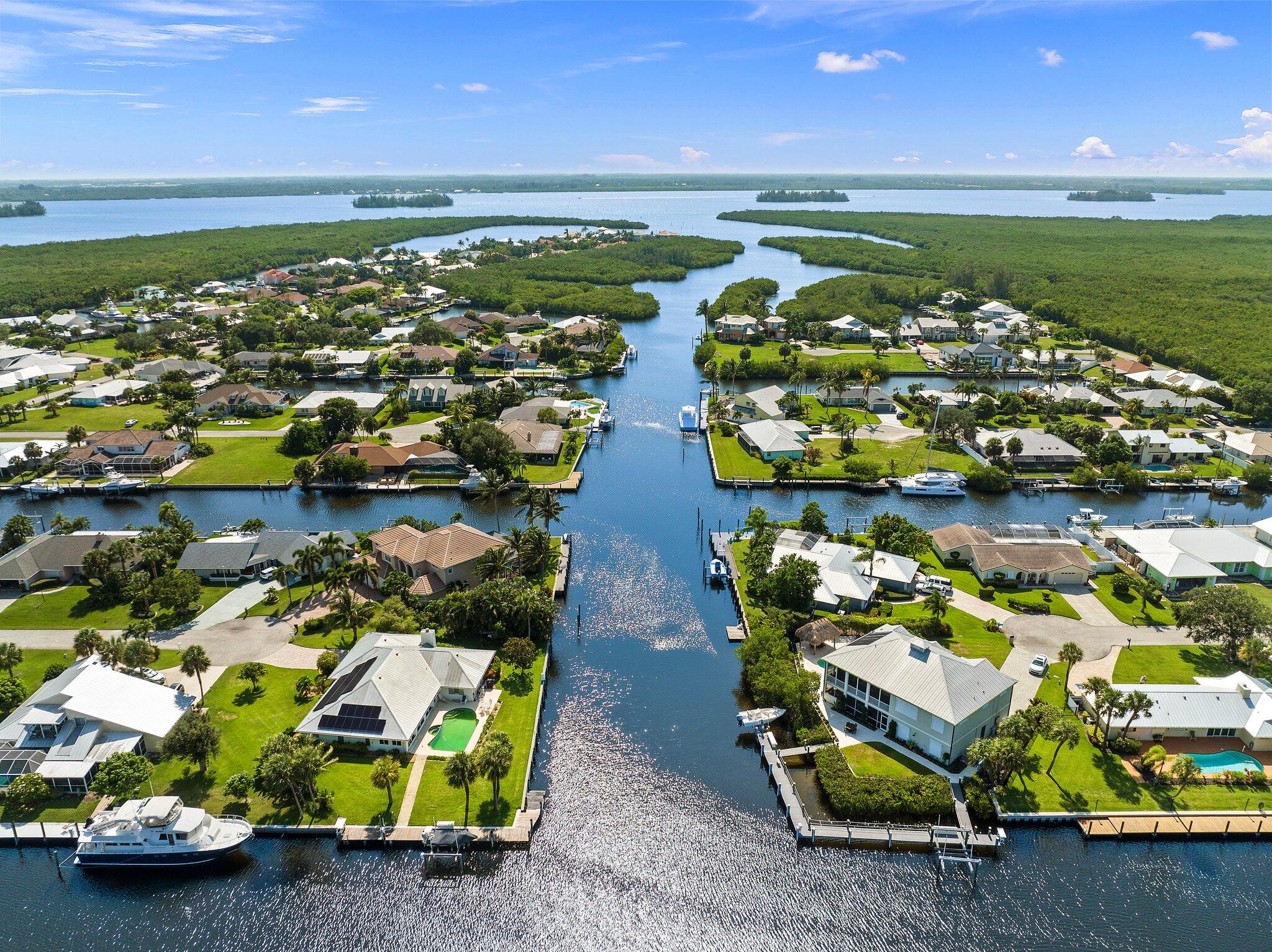 a view of a lake with lawn chairs