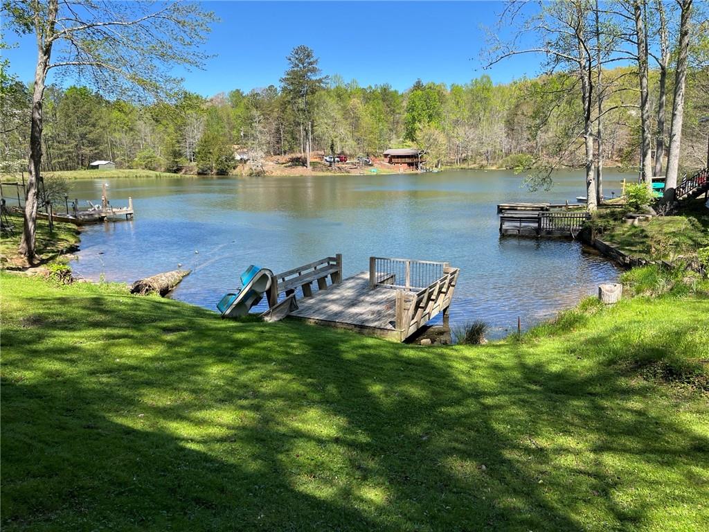 a view of a lake with houses in the back