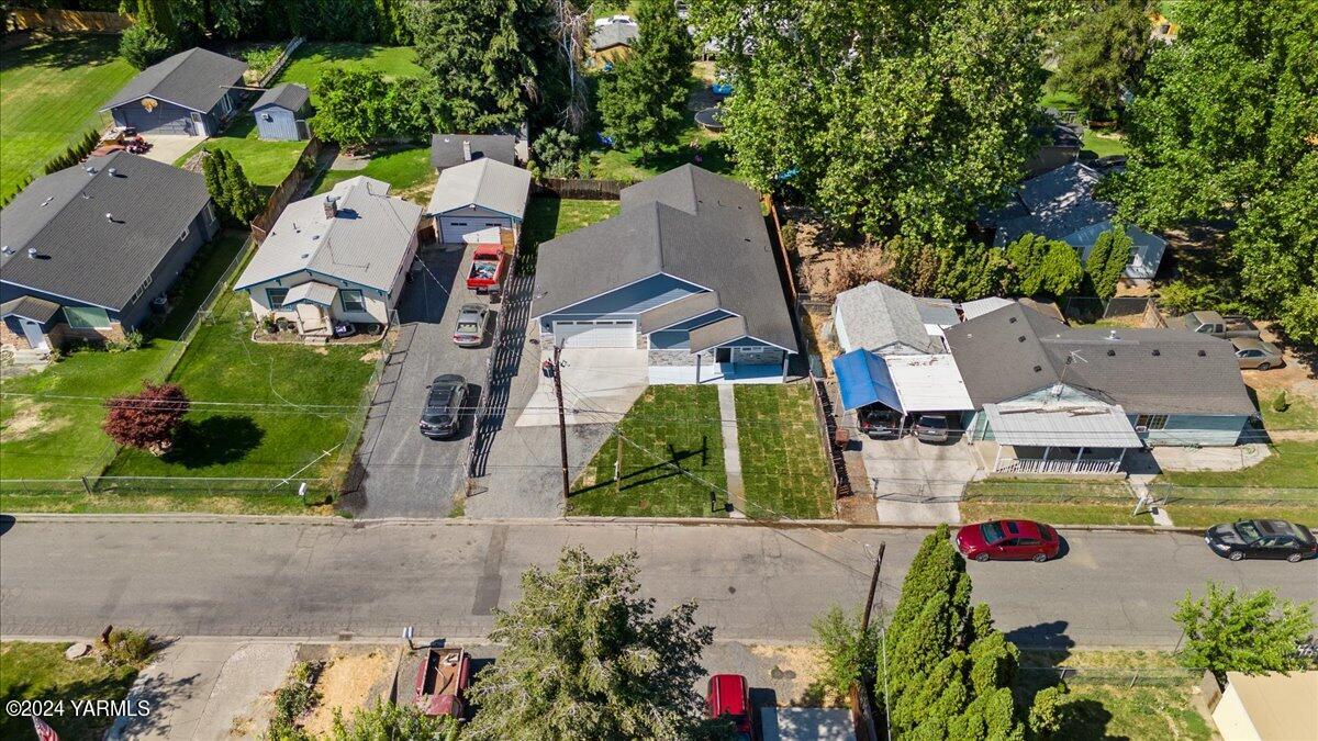 an aerial view of residential house with outdoor space and swimming pool