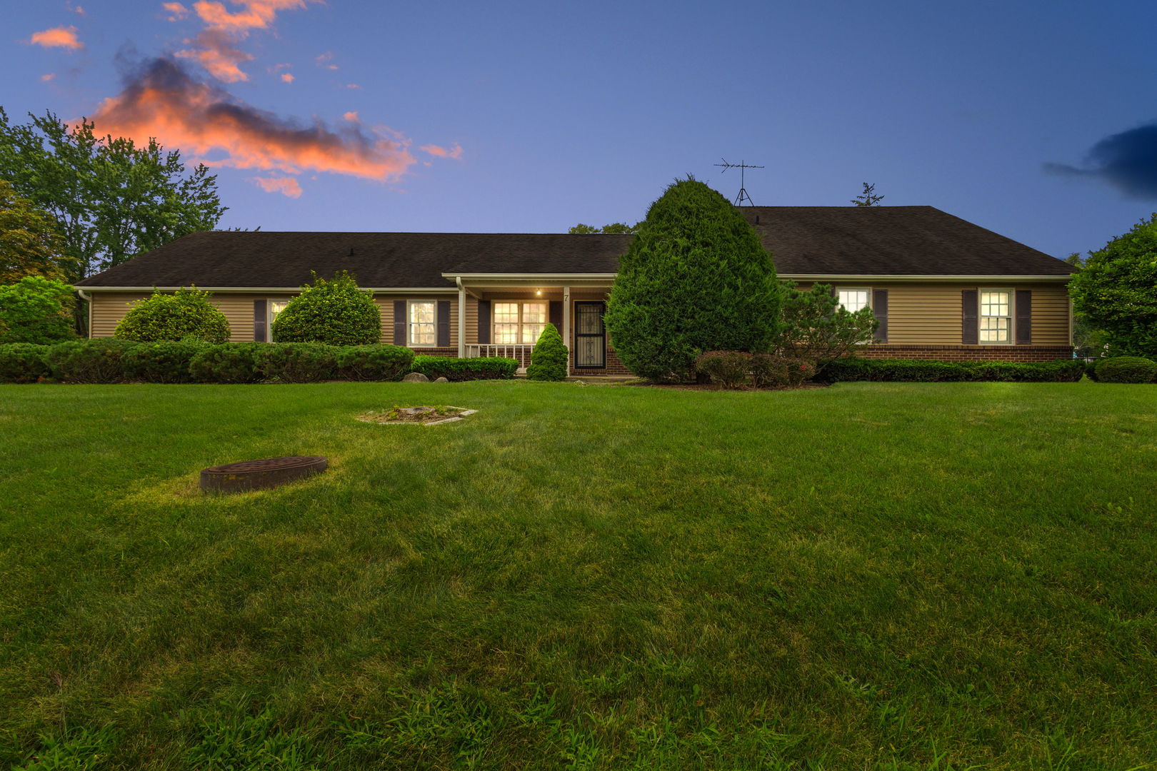 a front view of a house with a yard