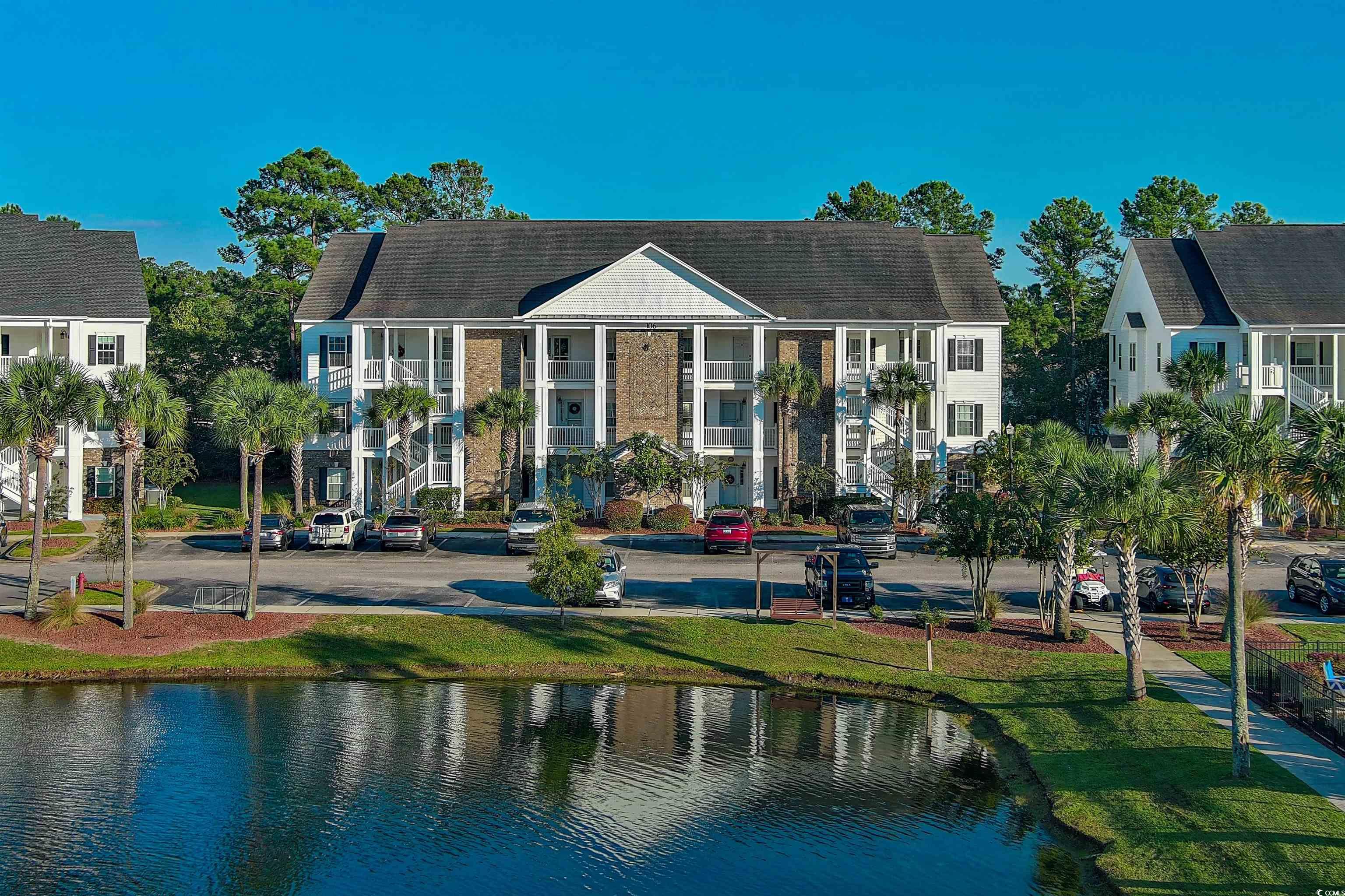 View of front of house with a water view and a fro