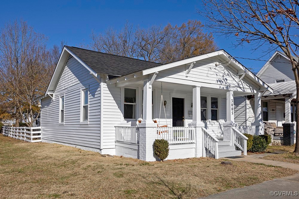 View of front facade featuring covered porch and a