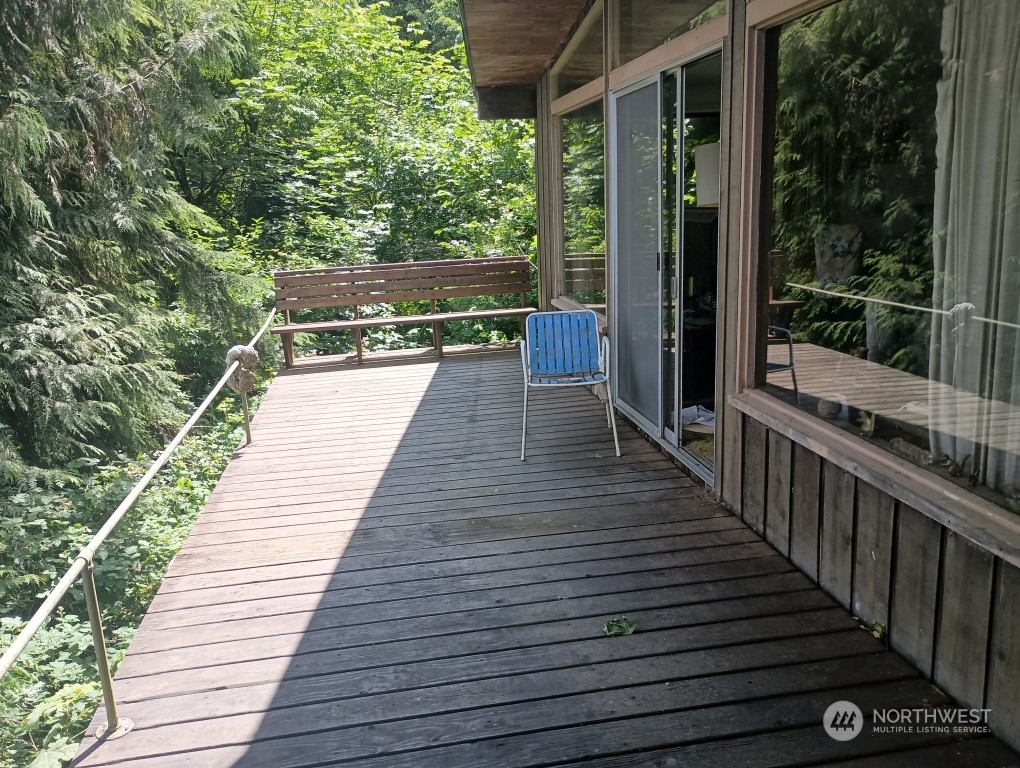 a view of balcony with wooden floor and outdoor space