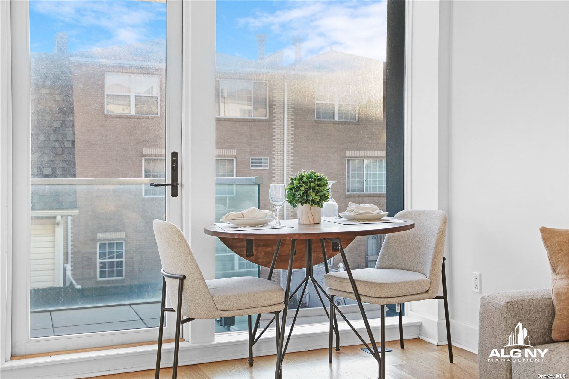 a view of a dining room with furniture and wooden floor