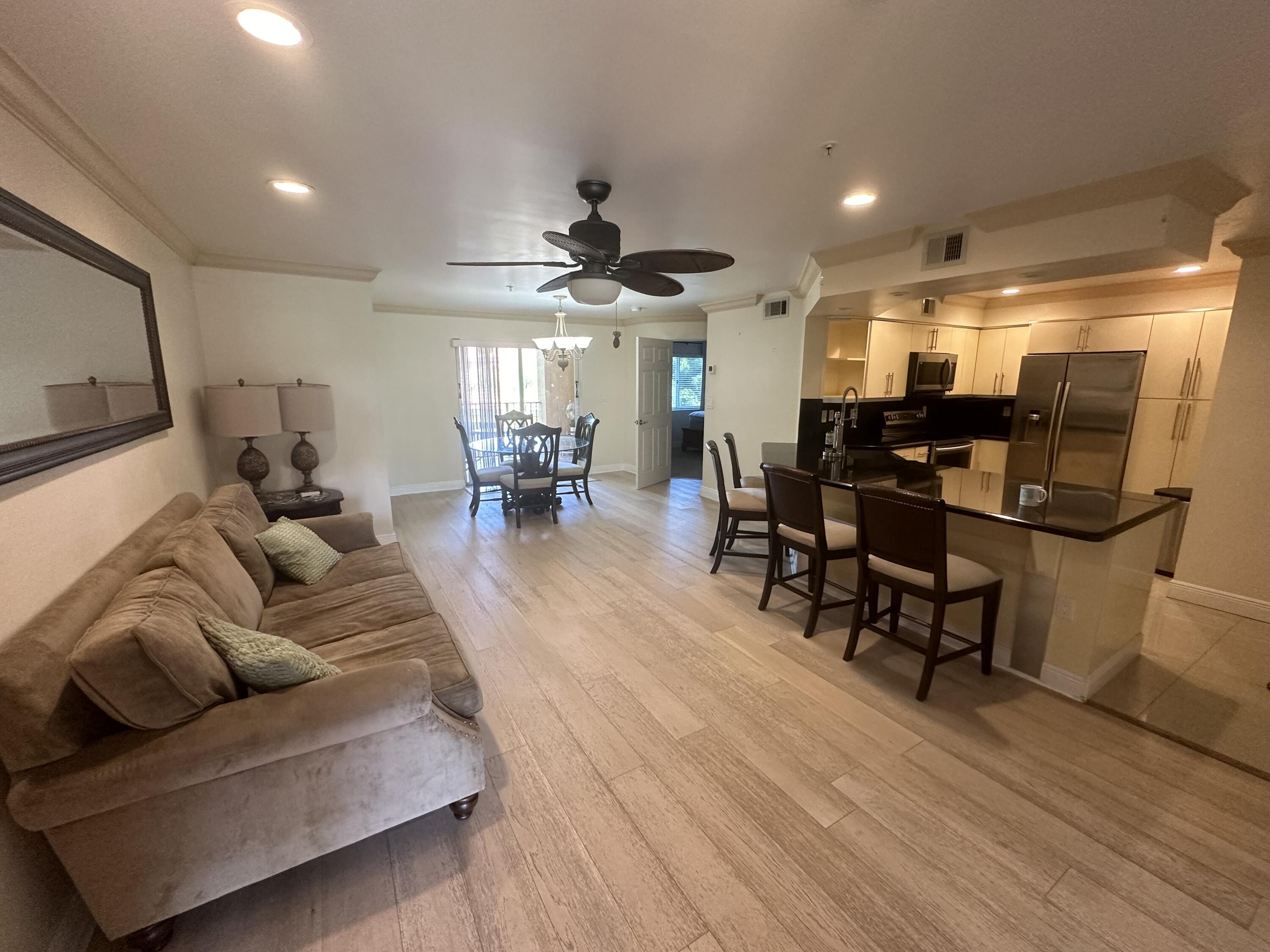 a living room with furniture and a large mirror