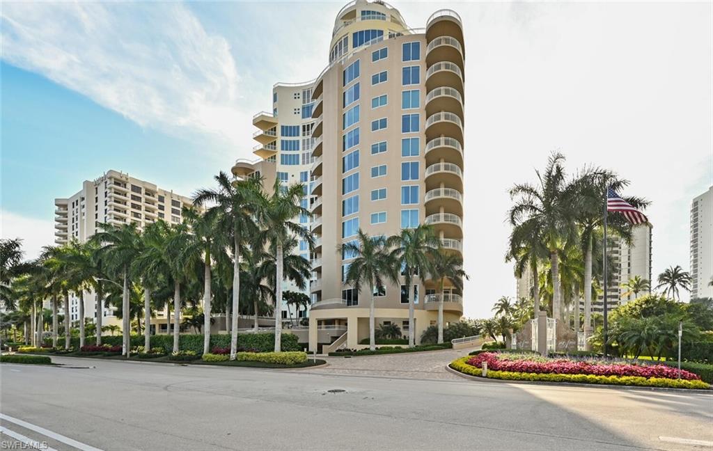 a view of a tall building next to a road