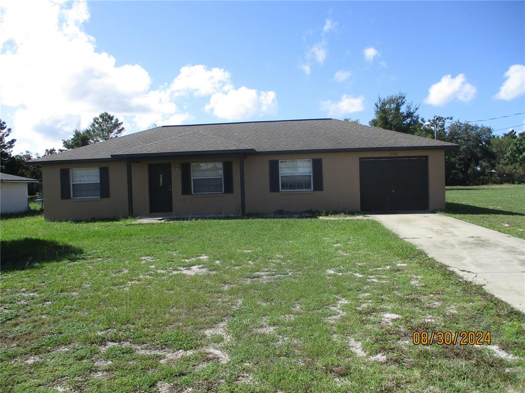 a brick house with a yard