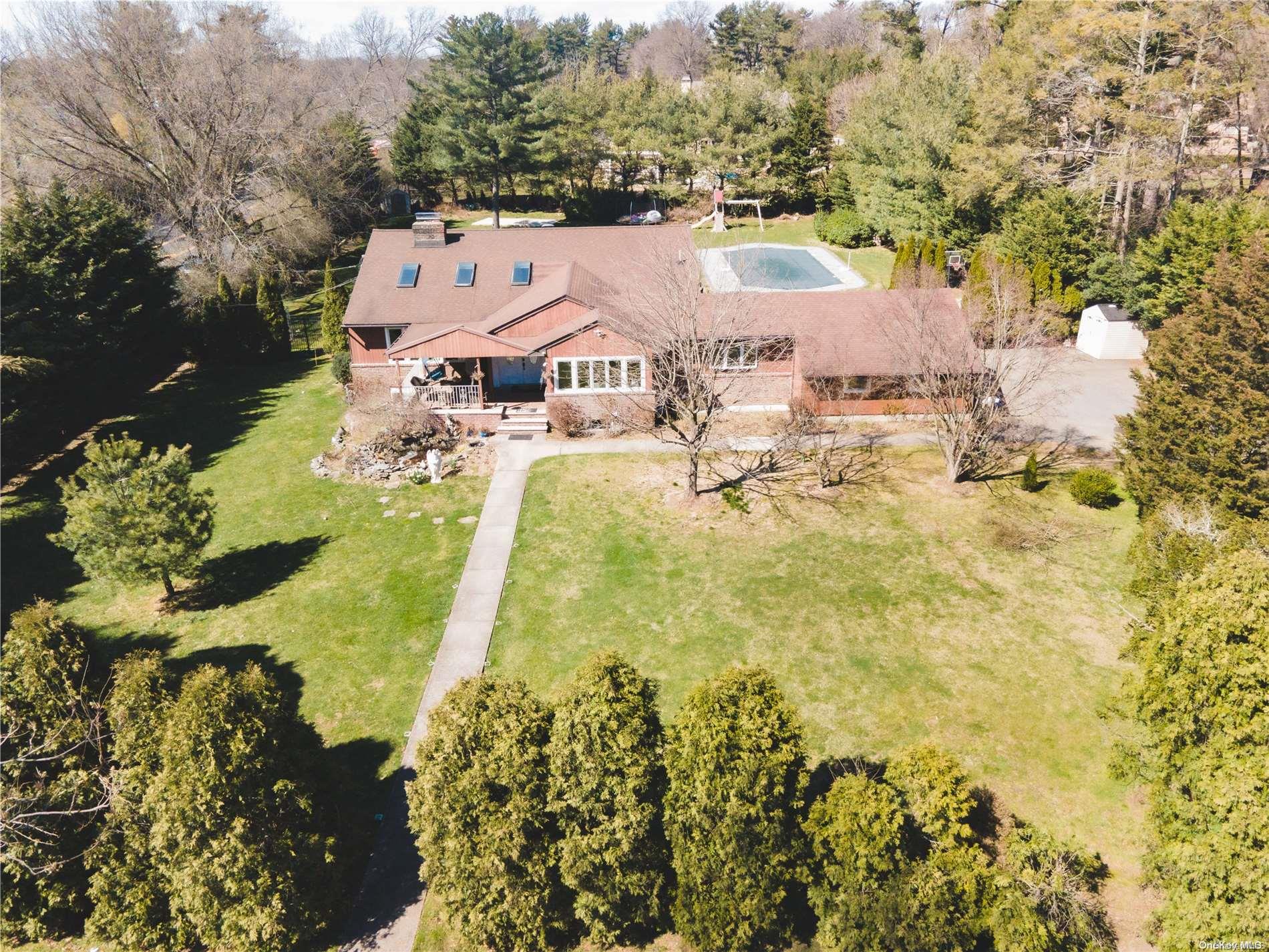 an aerial view of residential houses with yard