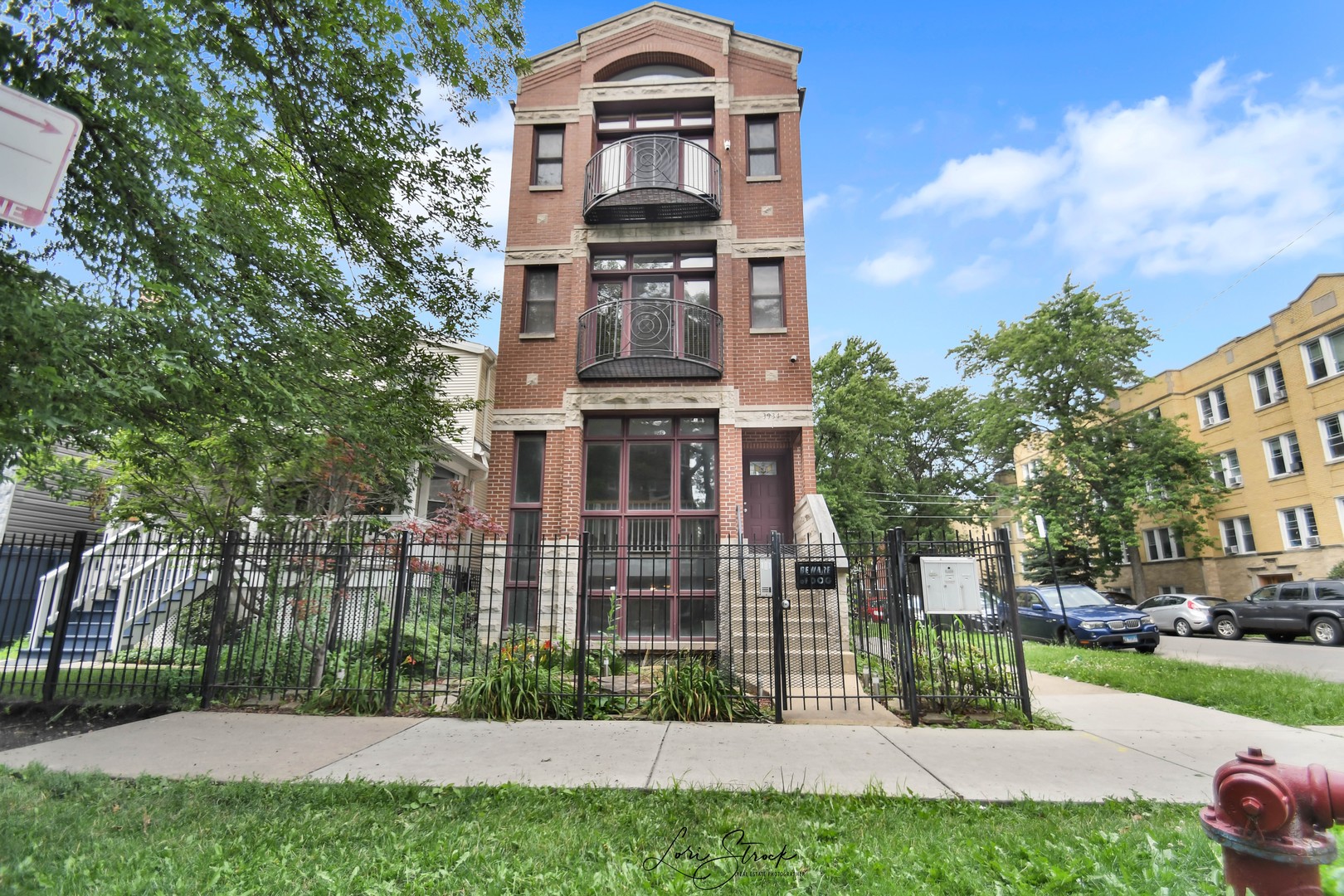 a view of a building with a yard