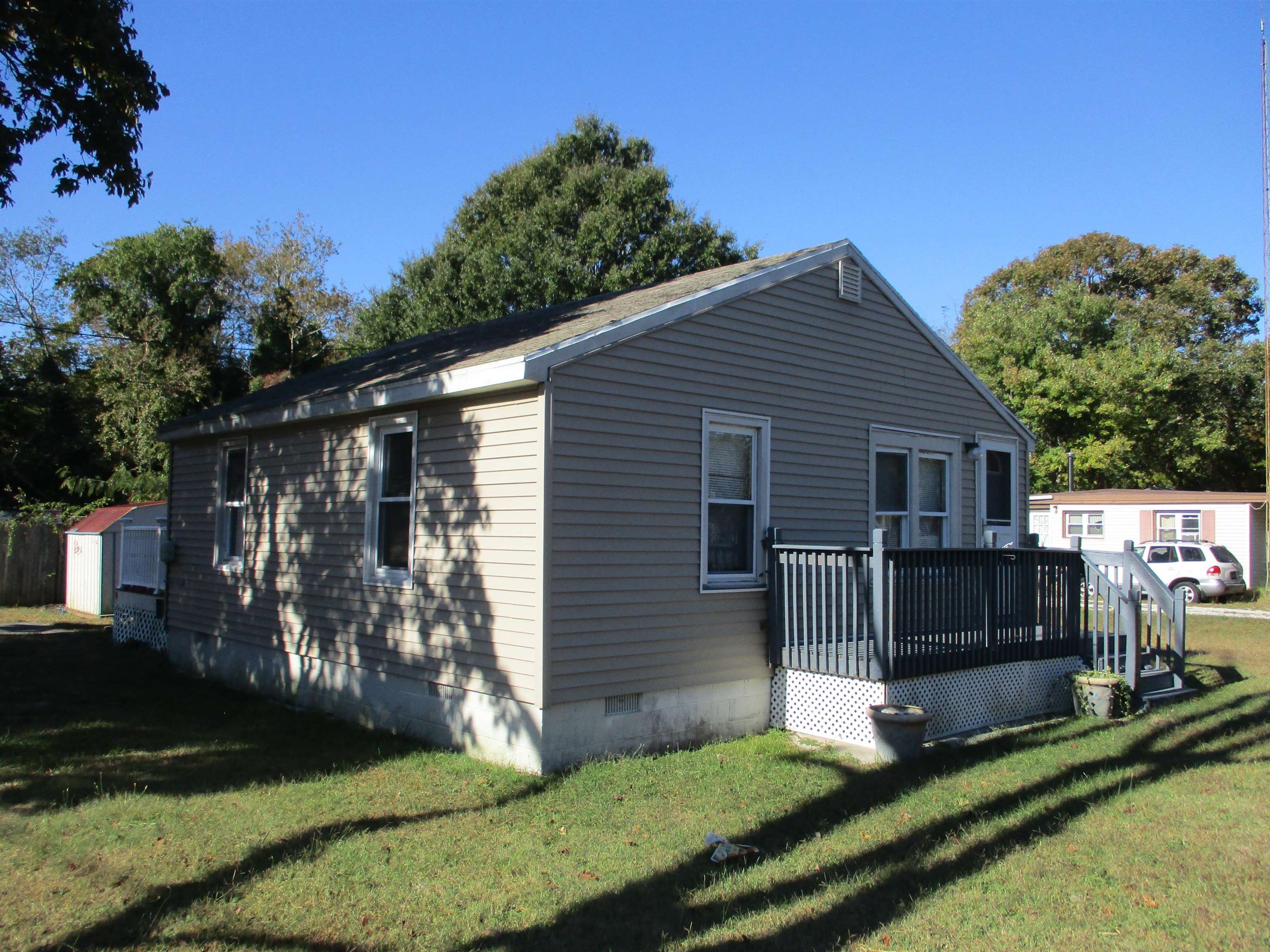 a view of house with backyard