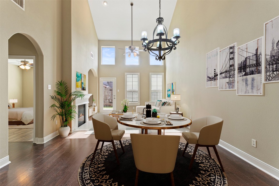 a view of a dining room with furniture wooden floor and chandelier