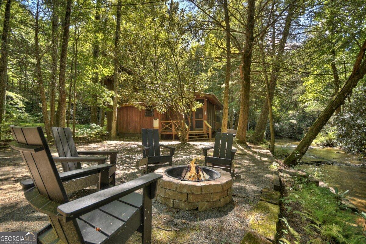 a view of a backyard with sitting area