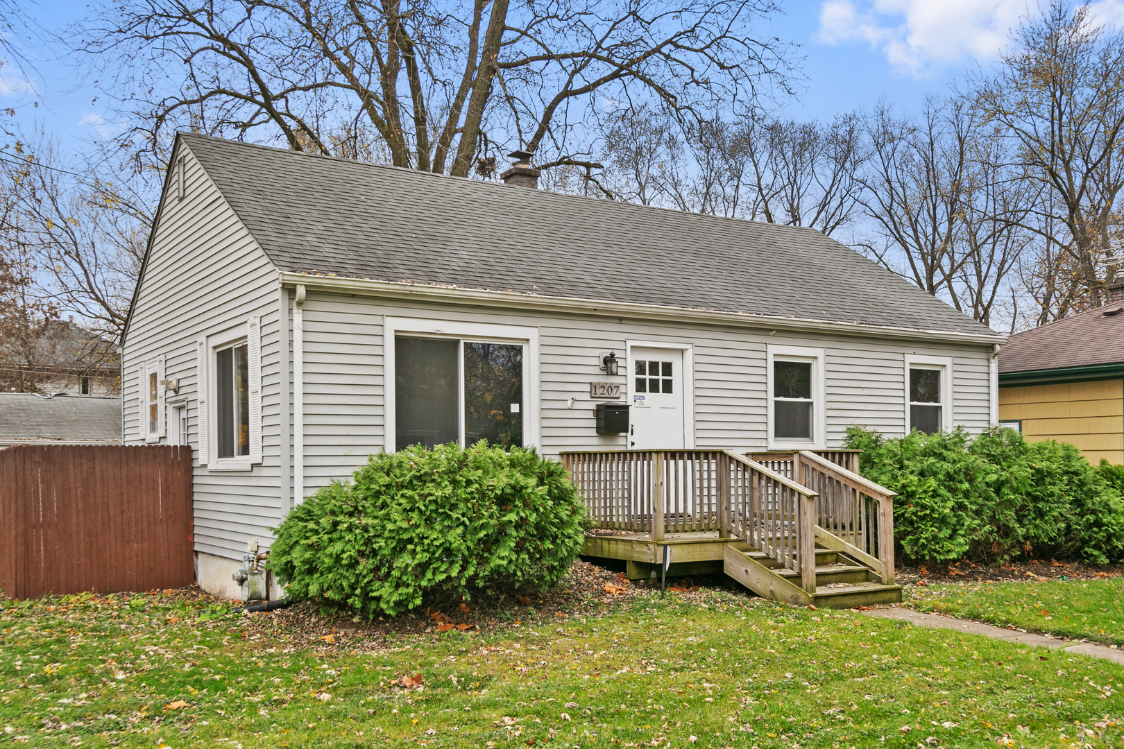 a view of a house with a yard porch and sitting area