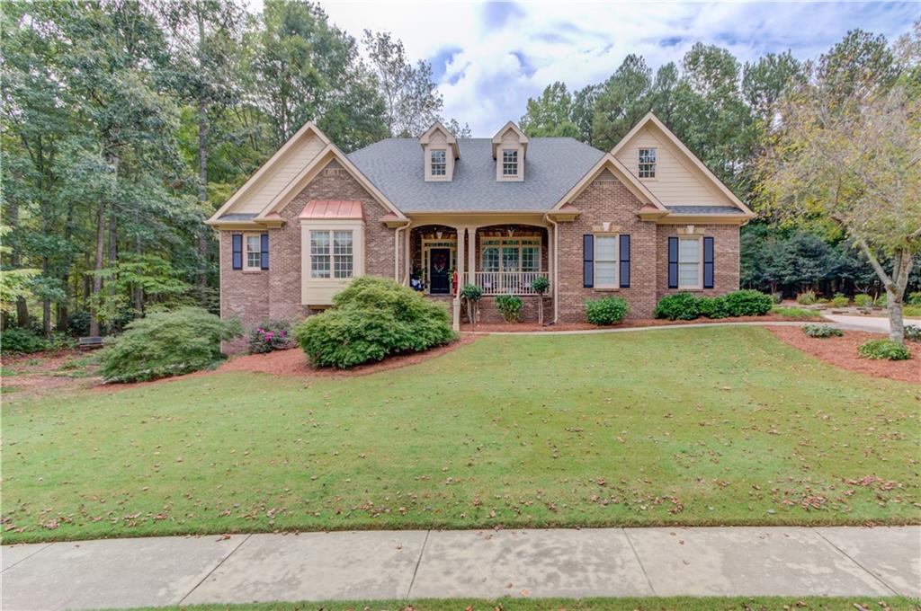 a front view of a house with a yard