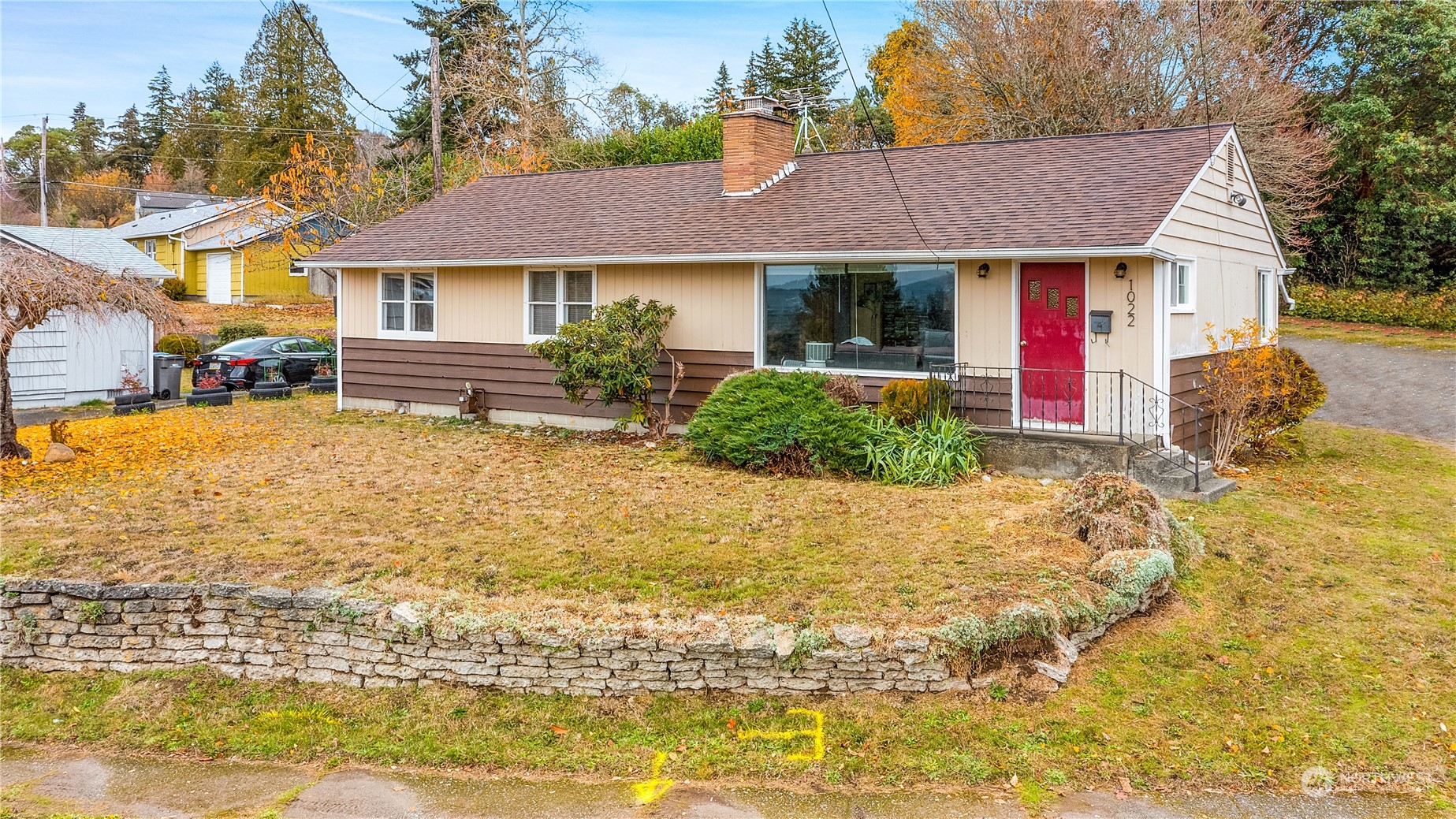 a front view of a house with garden