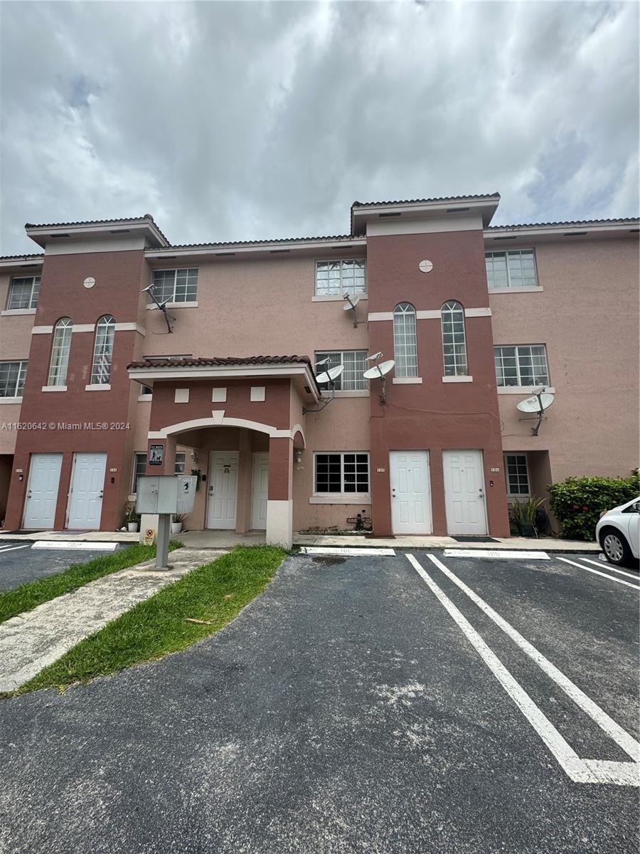 a front view of a building with a road